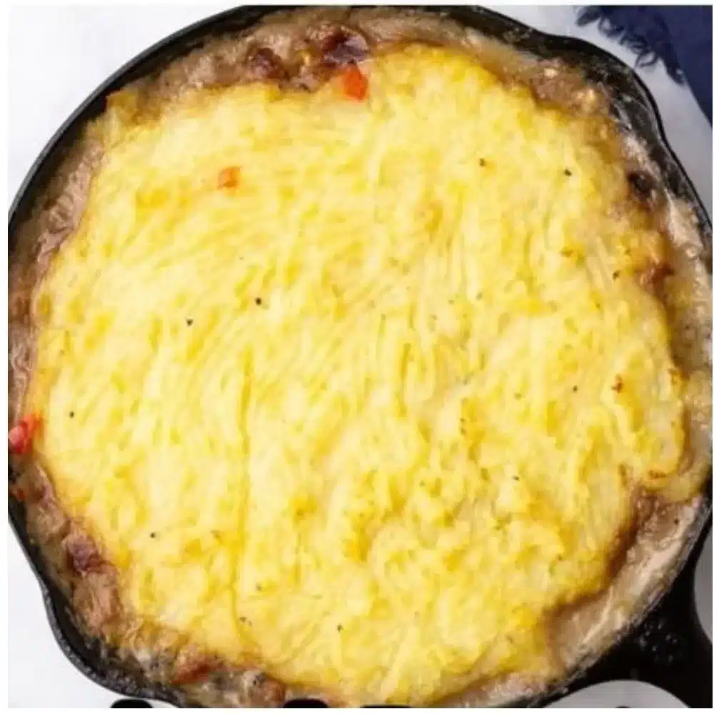 Delicious chicken and mashed potatoes casserole topped with cheese and herbs