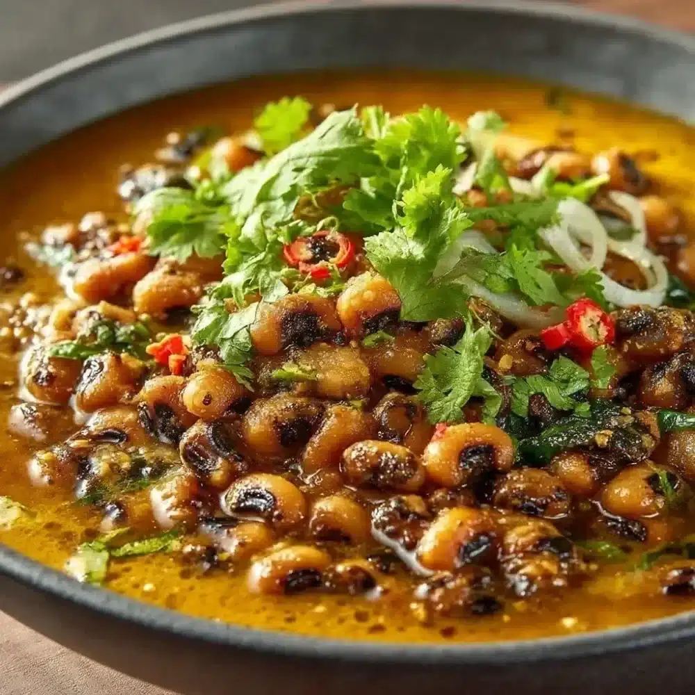 Bowl of Curried Black Eyed Peas with spices and herbs
