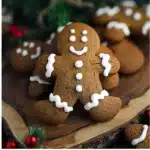 Baked Gingerbread Man cookies decorated with icing and candy