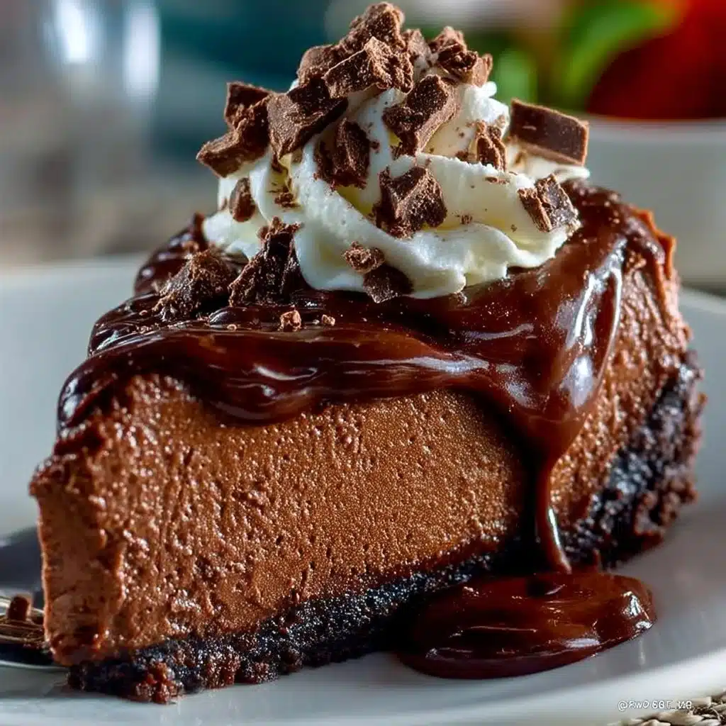 Delicious slice of the best chocolate cheesecake topped with chocolate ganache