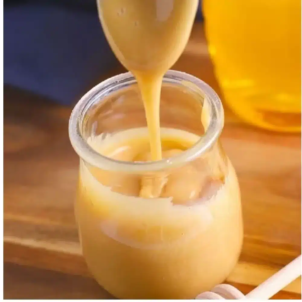 Jar of creamy whipped honey ready to enhance your meals and snacks.