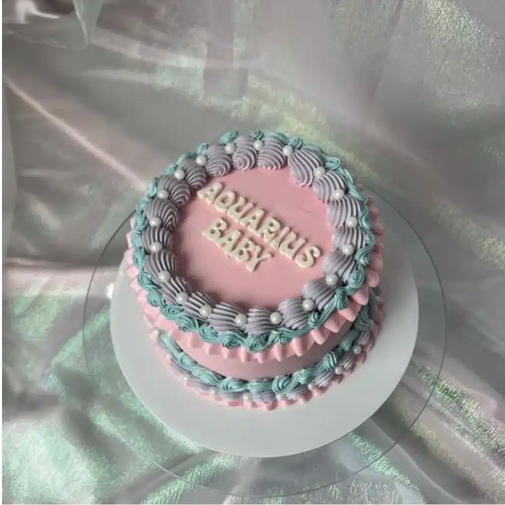 6-inch chocolate cake with strawberry filling and pastel decoration