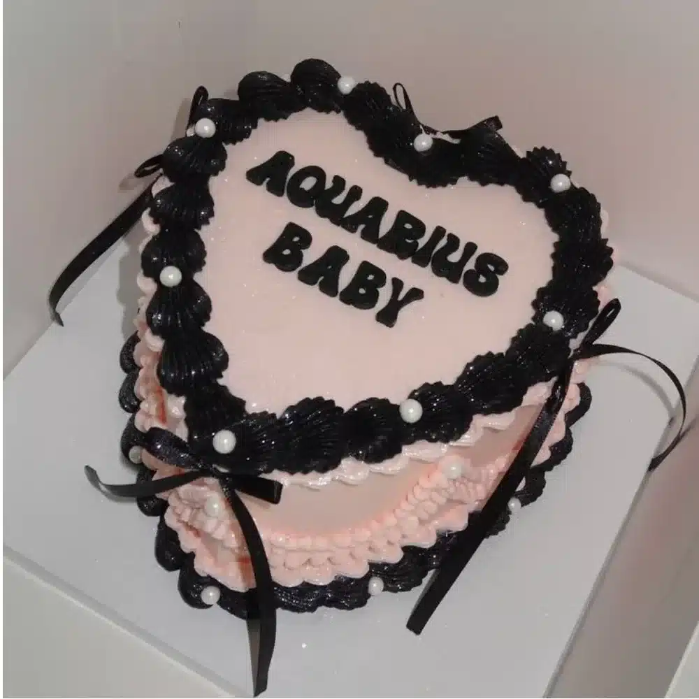Aquarius Baby Cake featuring astrological designs and baby-themed decorations.