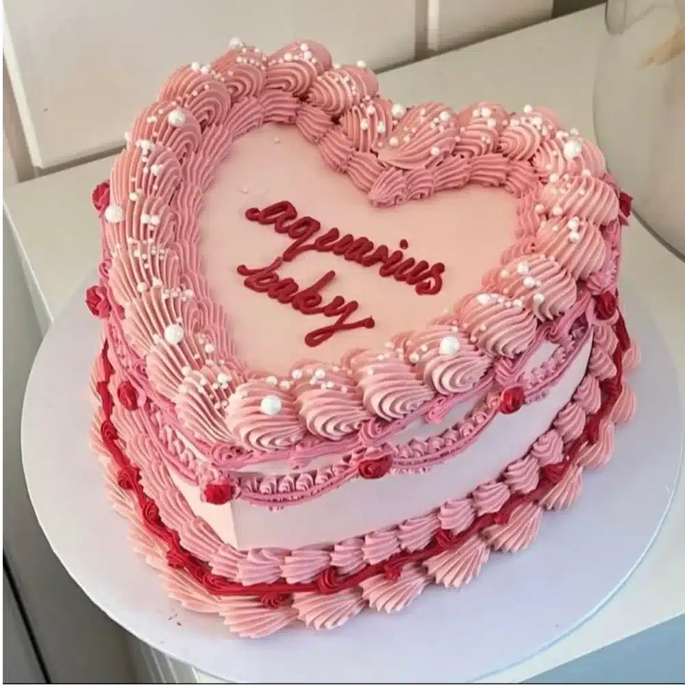 Beautiful Aquarius birthday cake adorned with zodiac symbols and blue decorations