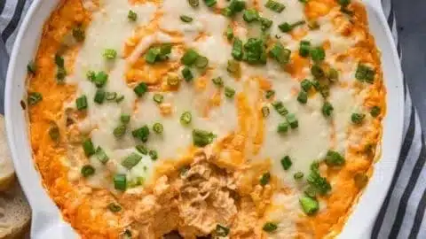 Delicious creamy Buffalo Chicken Dip served in a bowl with tortilla chips