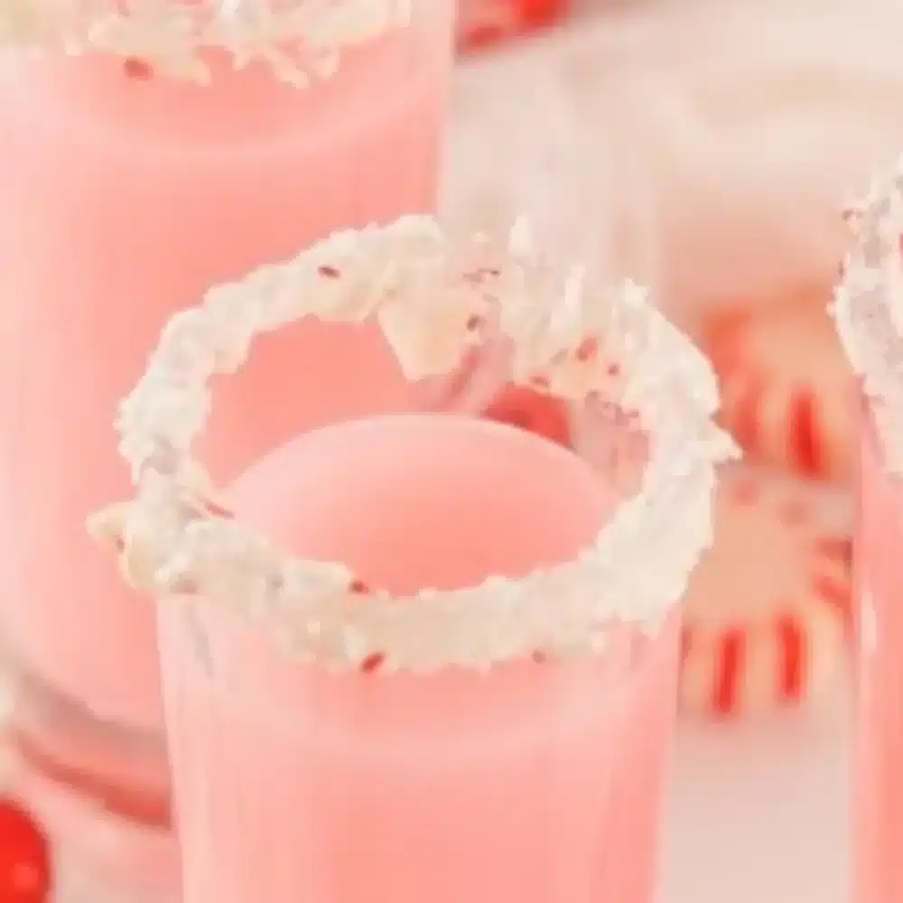Holiday-themed candy cane shots for festive celebrations