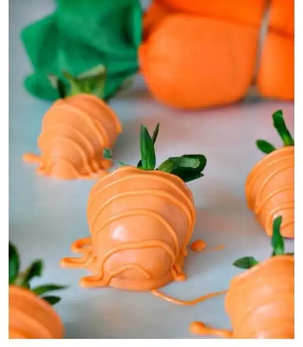 Delicious carrot chocolate covered strawberries arranged on a platter