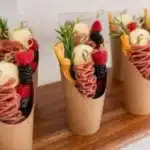 Elegant charcuterie cups and toothpicks for wedding and event catering.