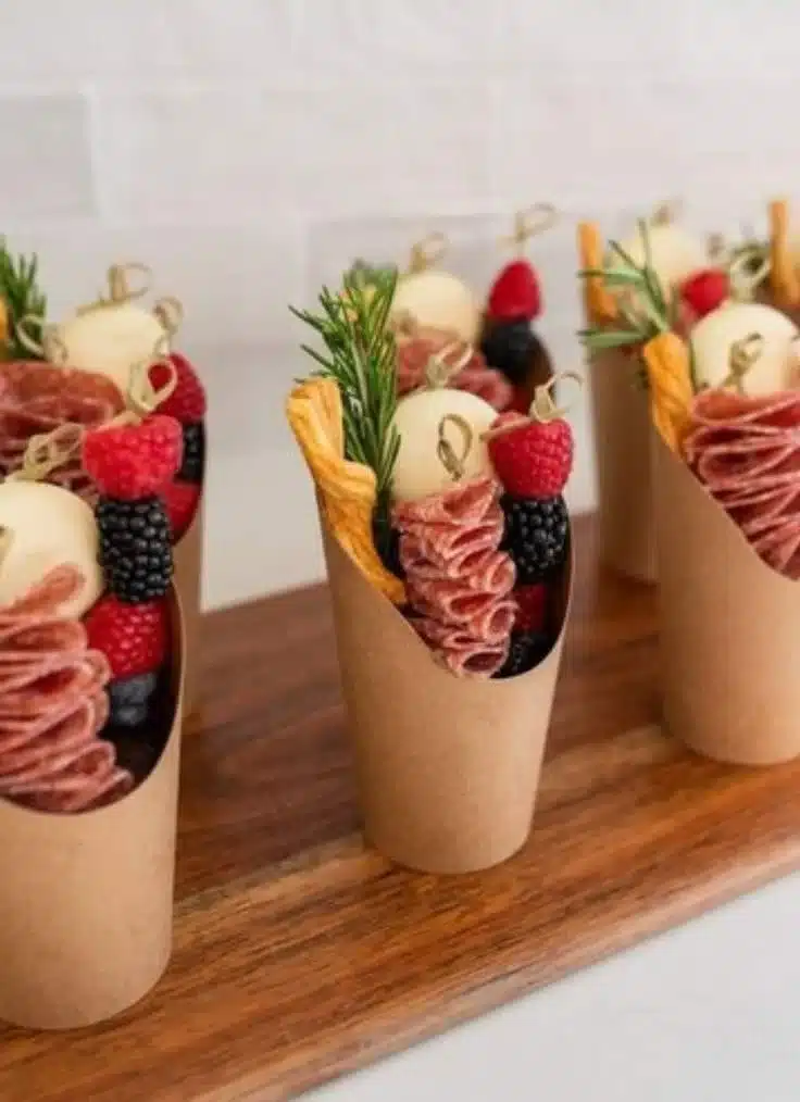 Elegant charcuterie cups and toothpicks for wedding and event catering.