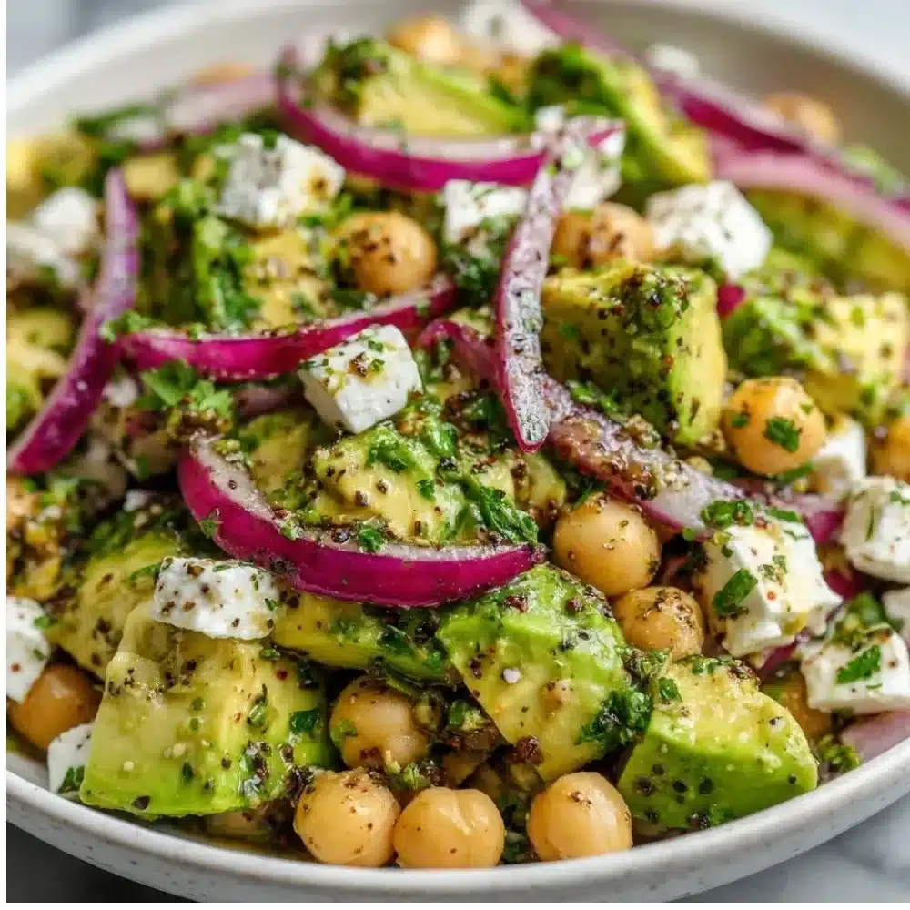 Chickpea Feta Avocado Salad with colorful vegetables and herbs