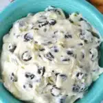 A creamy chocolate chip cheesecake dip served with graham crackers and fruit