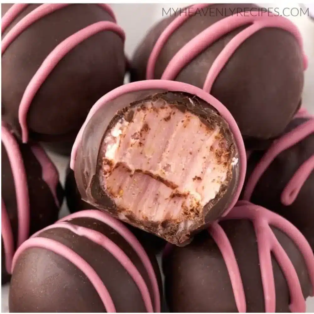 Chocolate Raspberry Truffles on a decorative plate with fresh raspberries
