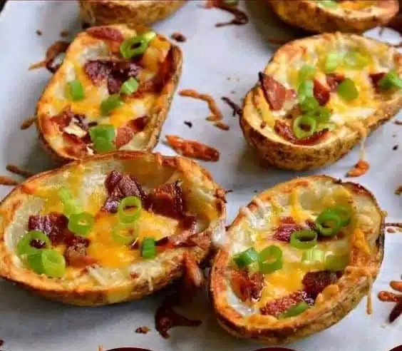 Crispy baked potato skins topped with bacon and green onions