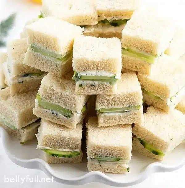 Delicious cucumber sandwiches on a plate, perfect for tea parties.