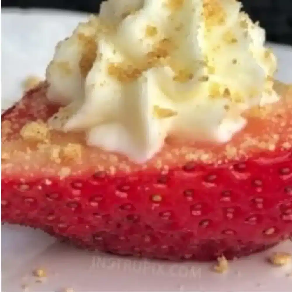 Deviled strawberries with cheesecake filling on a decorative plate