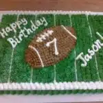 Custom Football Cake from Main Made with vibrant green grass and team decorations