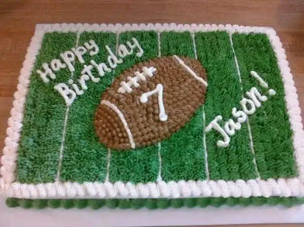 Custom Football Cake from Main Made with vibrant green grass and team decorations