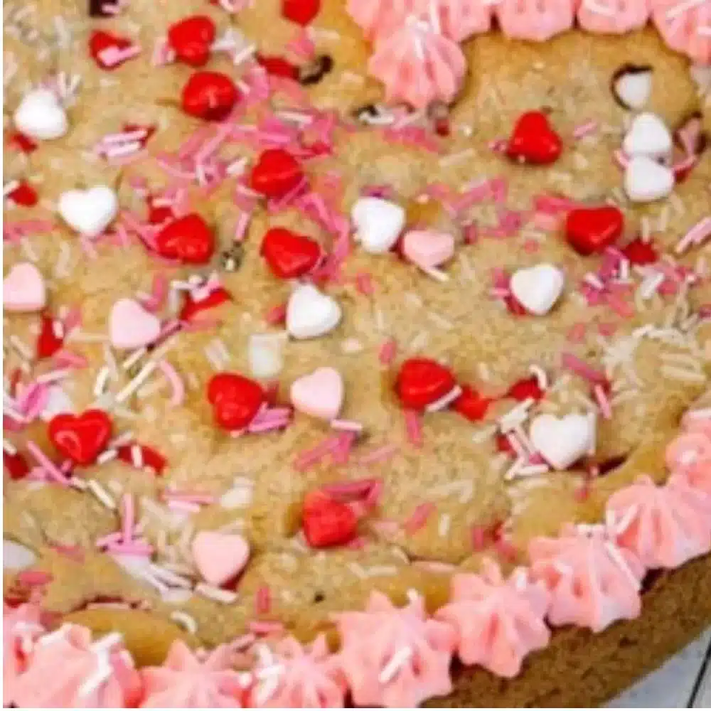 Delicious heart shaped cookie cake decorated for a celebration