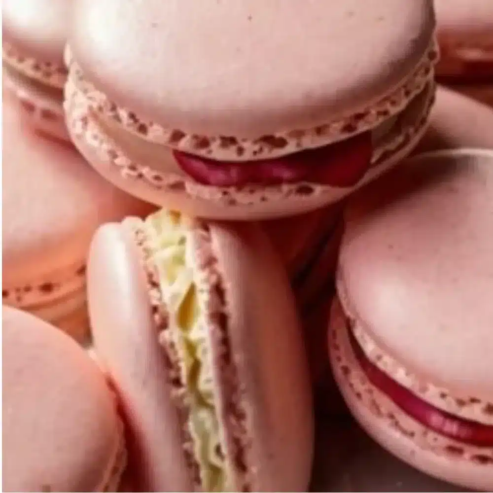 Delicious heart-shaped macarons in various colors and flavors.