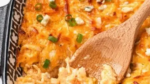 High protein buffalo chicken dip served in a bowl with chips