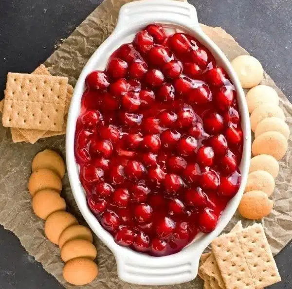 Delicious luscious dessert dip served with fruits and snacks
