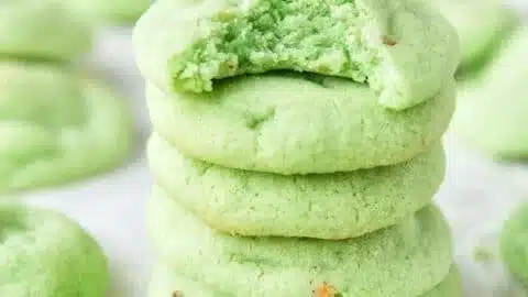 Pistachio pudding cookies displayed on a plate, showcasing their soft texture and vibrant color.