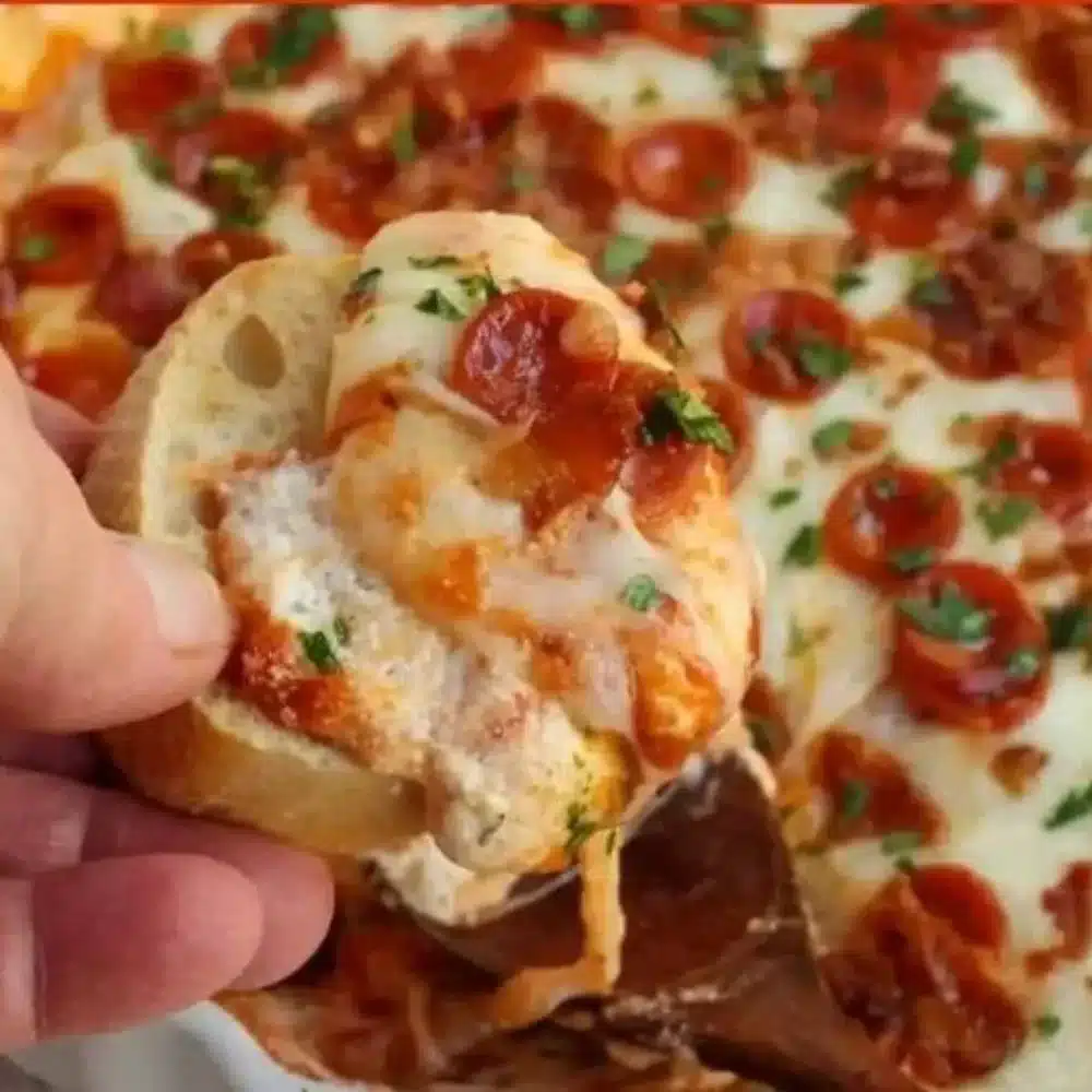 Delicious Pizza Dip with cream cheese and pepperoni served in a bowl