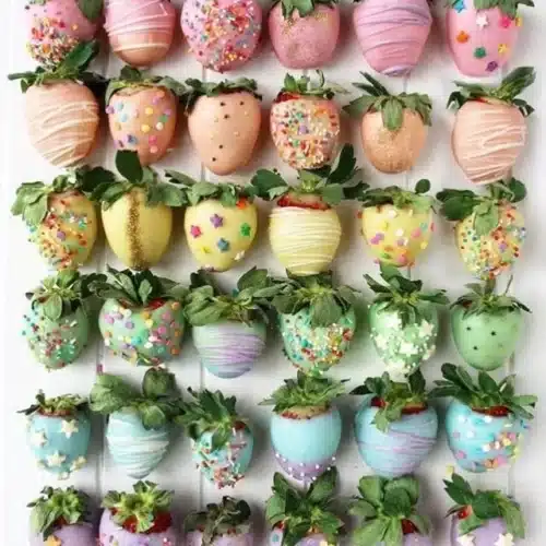 Vibrant rainbow strawberries decorated for a festive celebration.