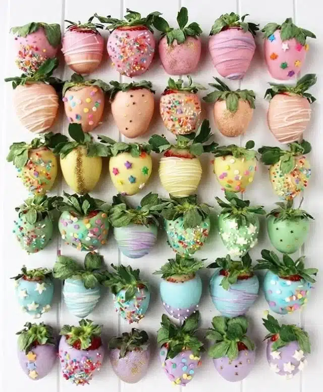 Vibrant rainbow strawberries decorated for a festive celebration.