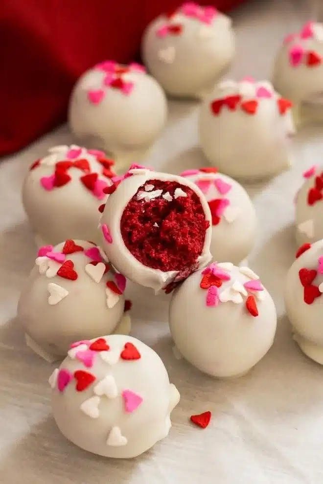 Delicious Red Velvet Cake Balls piled high on a decorative plate.