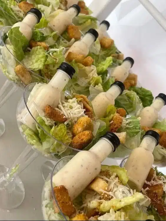 Set of Salad Appetizer Cups with dressing bottle and mini forks for serving