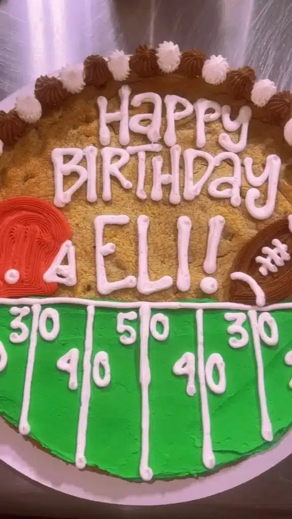 Delicious football-shaped cookie cakes from Shug's for game day celebrations.