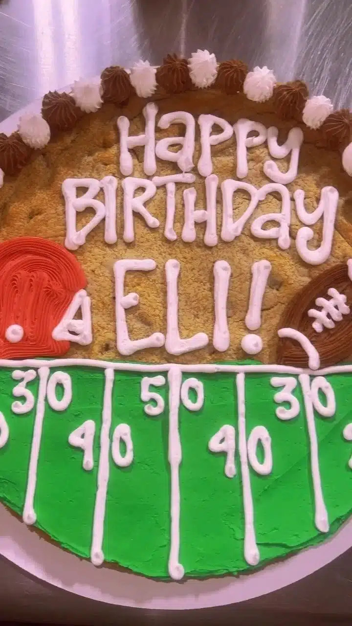 Delicious football-shaped cookie cakes from Shug's for game day celebrations.