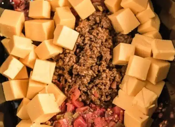 Creamy slow cooker queso dip served with tortilla chips