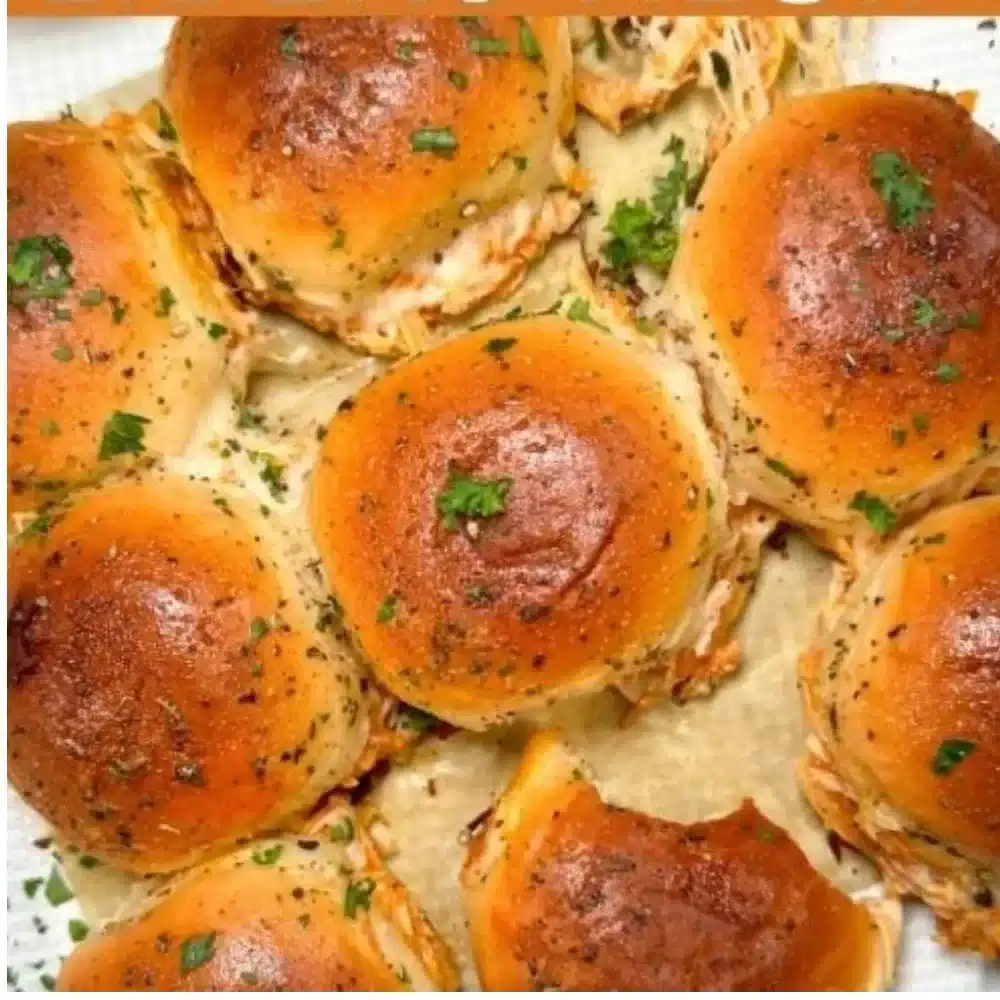Delicious spicy Buffalo chicken sliders served on a platter.