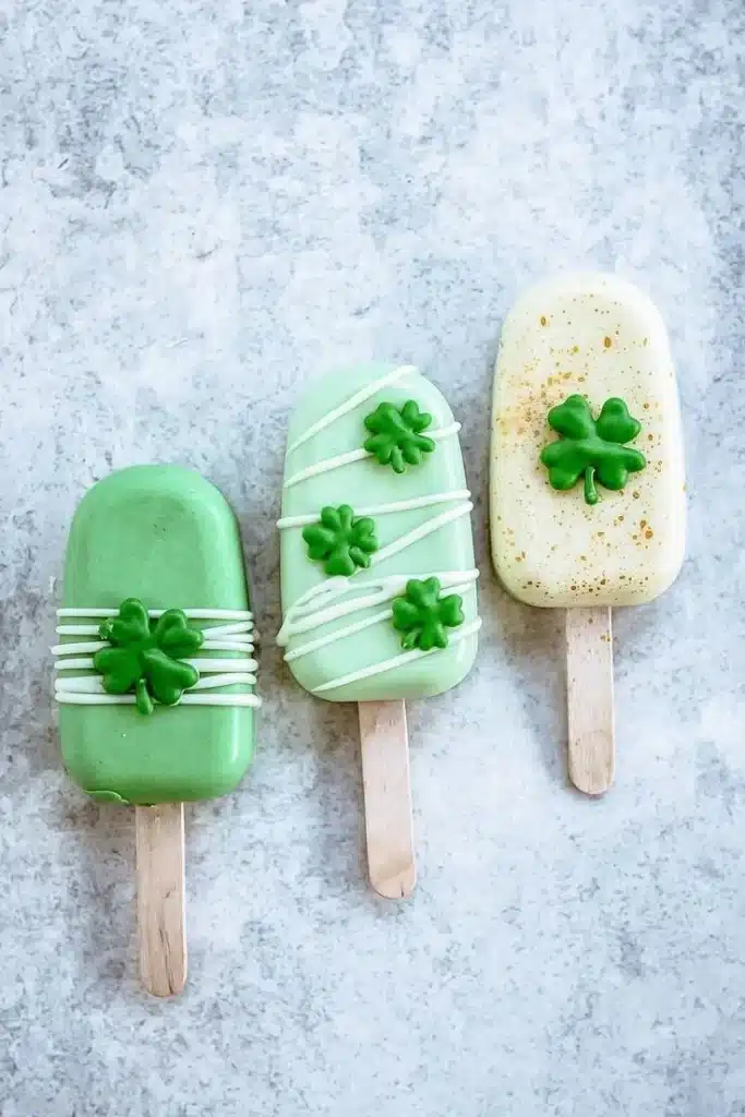 St. Patrick's Day themed green chocolate lollies on a festive background