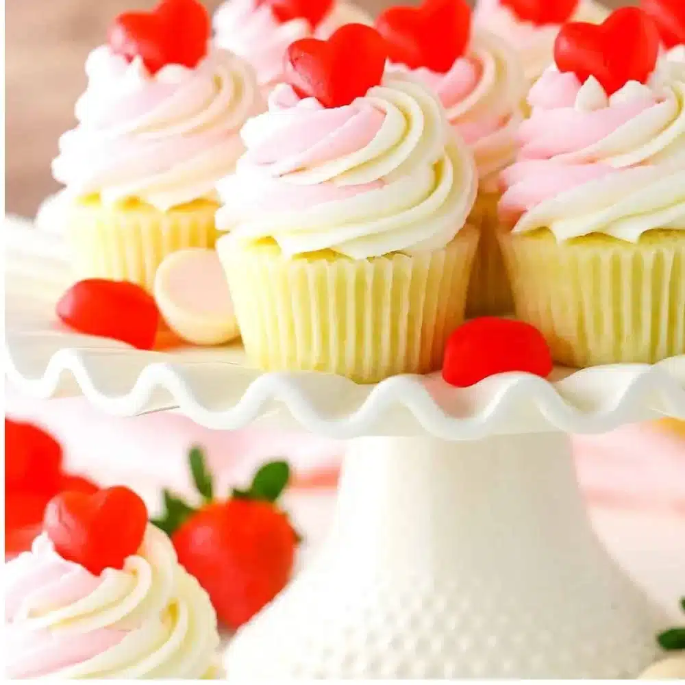 Delicious strawberry truffle cupcakes topped with fresh strawberries and chocolate