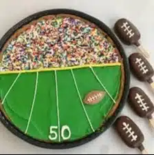 Delicious football-themed cakes by Tres Belle Cakes for game day parties.