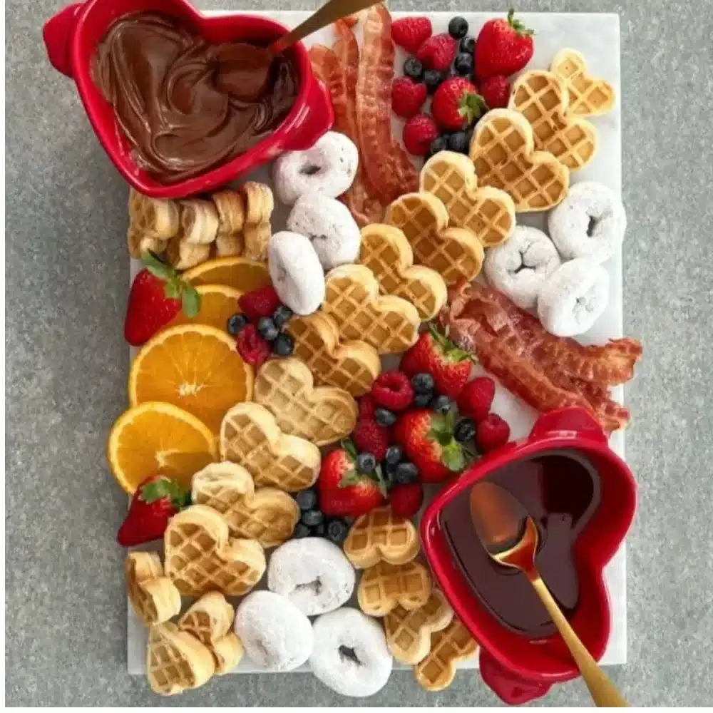 Valentine Charcuterie Platter featuring assorted meats, cheeses, and fruits.