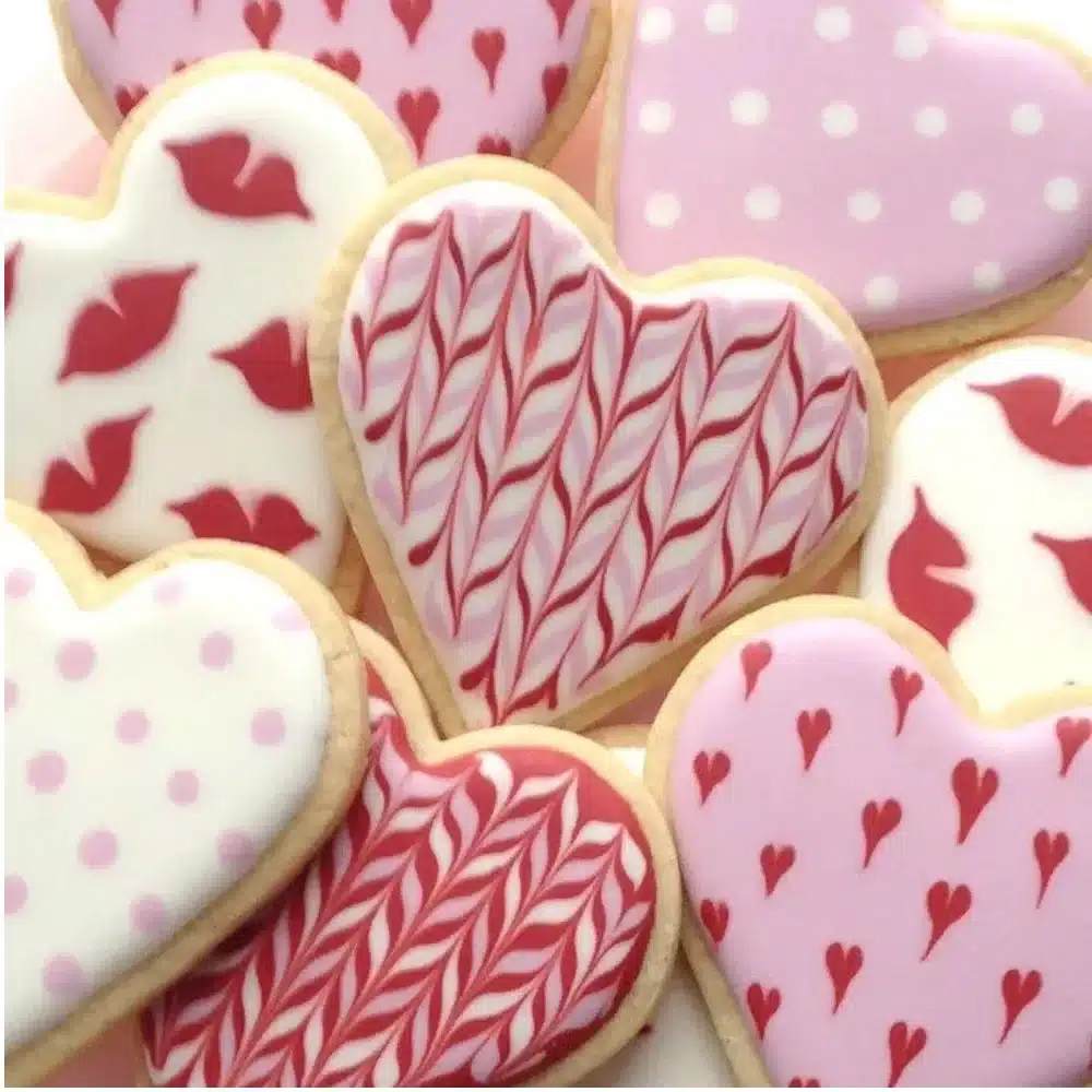 Homemade Valentine's Day cookies decorated with hearts and pink icing