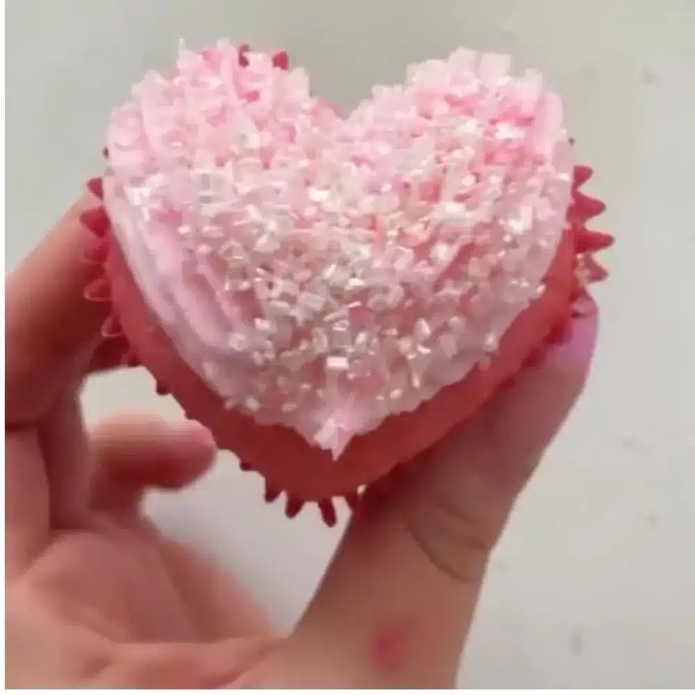 Festively decorated Valentine's Day cupcakes with hearts and pink frosting