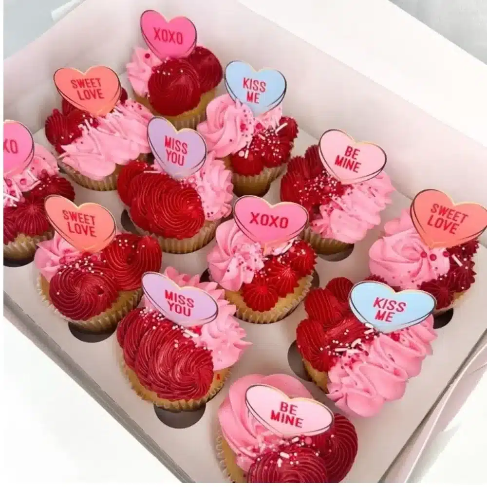 Delicious Valentine's Day cupcakes decorated with pink icing and heart sprinkles.