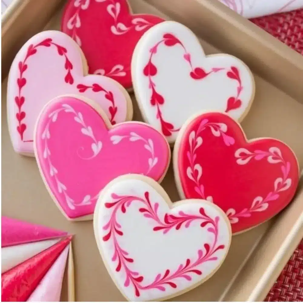 Valentine's Day cookies decorated with hearts and icing as part of a DIY tutorial