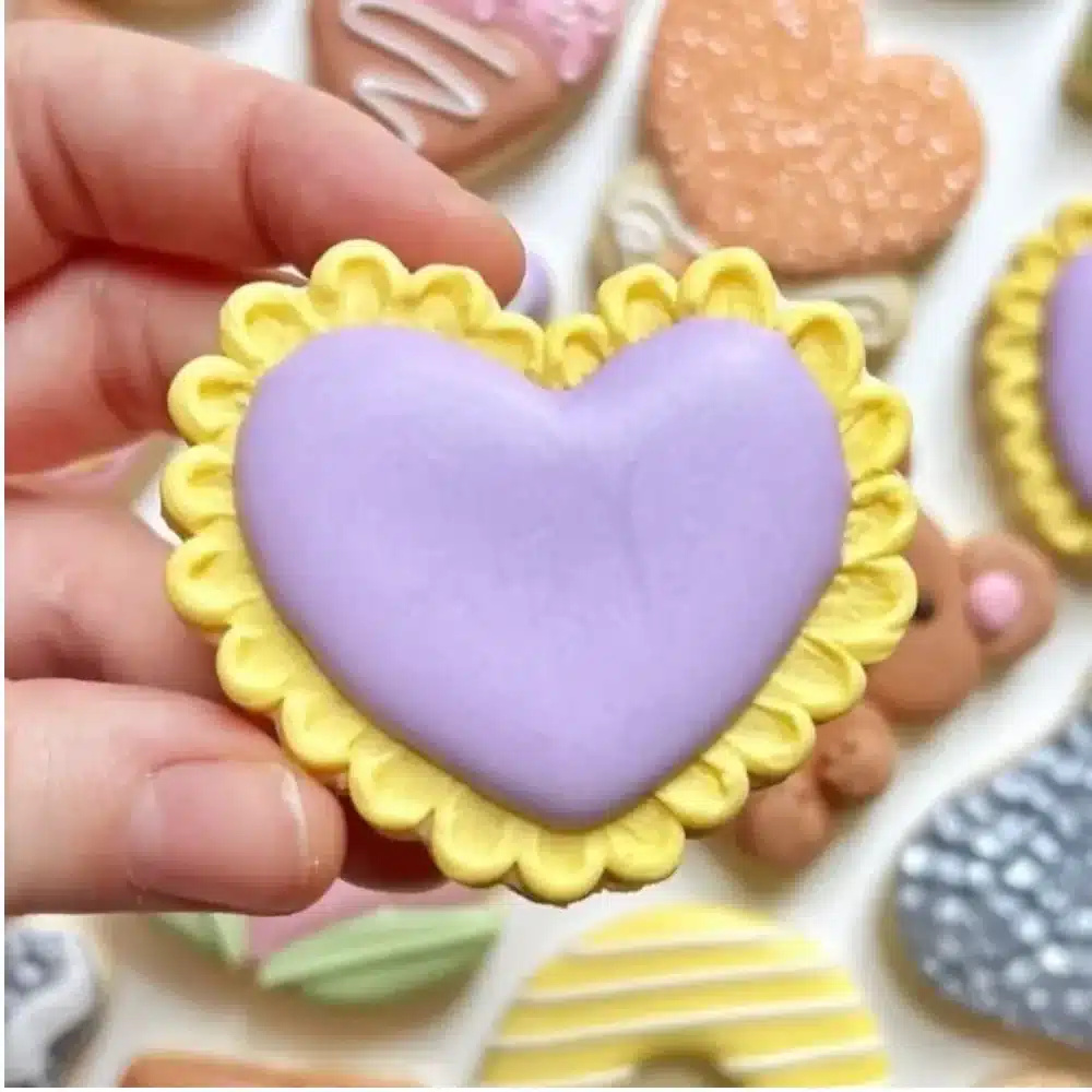 Heart-shaped Valentine's Day mini cookies decorated with pink and red icing.