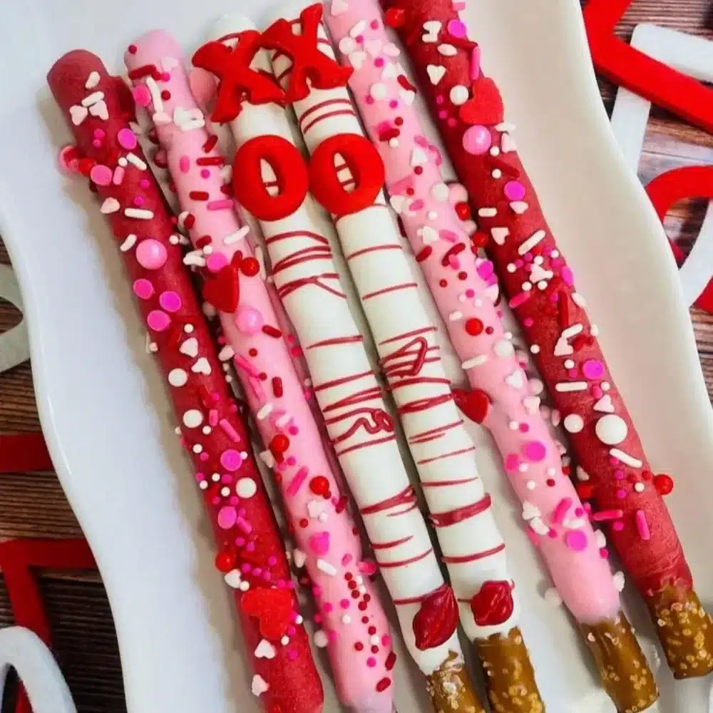 A dozen heart-shaped Valentine's Pretzels in pink and red colors