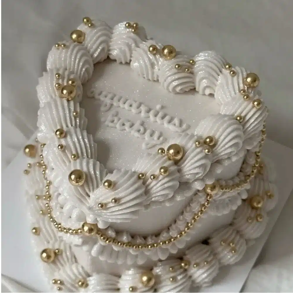 Delightful white vintage cake adorned with floral decorations