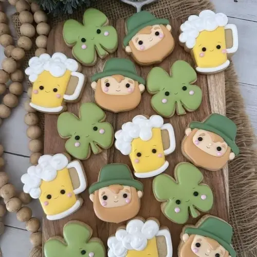 First communion cookies with an oval cross shape design by Andre Cookies.