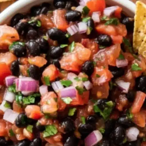 Delicious Black Bean Salsa with fresh vegetables served in a bowl