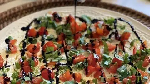 Delicious Bruschetta Dip served with fresh ingredients and crispy bread