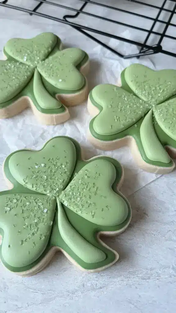 Custom St. Patrick’s Day cookies designed by Cami Logan, featuring intricate decorations.